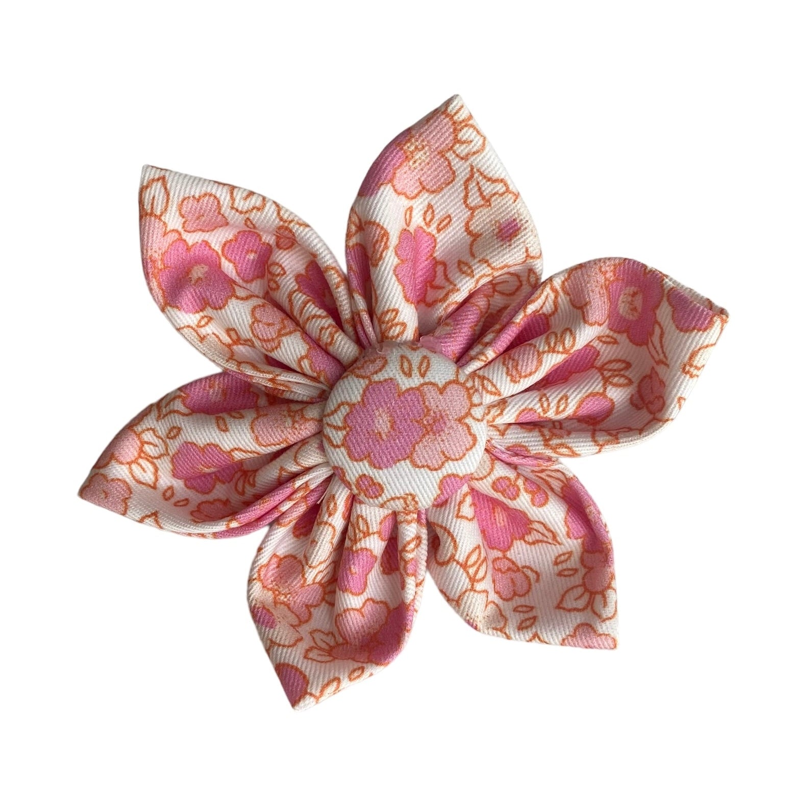 A cream dog collar flower with a lovely pink floral print.