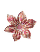 A cream dog collar flower with a lovely pink floral print.