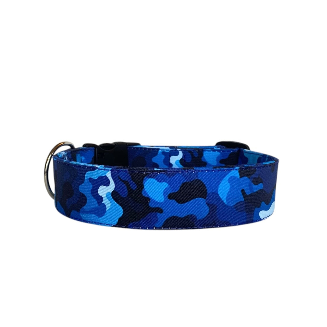 This blue camo personalized dog collar is a stylish and functional accessory for your dog. The collar features a pattern of blue camouflage, blending shades of navy, royal blue, and aqua with darker accents, giving it a trendy and modern look. The camo design is bold but not too overpowering, offering a nice balance between style and subtlety.