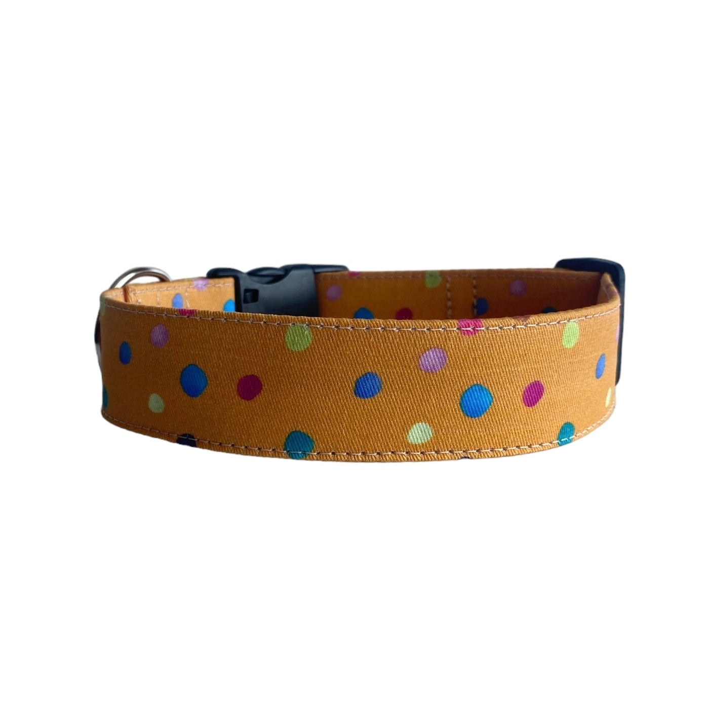 Featuring a warm mustard yellow background sprinkled with vibrant, multicolored polka dots, this collar adds a fun pop of personality.