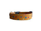 Featuring a warm mustard yellow background sprinkled with vibrant, multicolored polka dots, this collar adds a fun pop of personality.