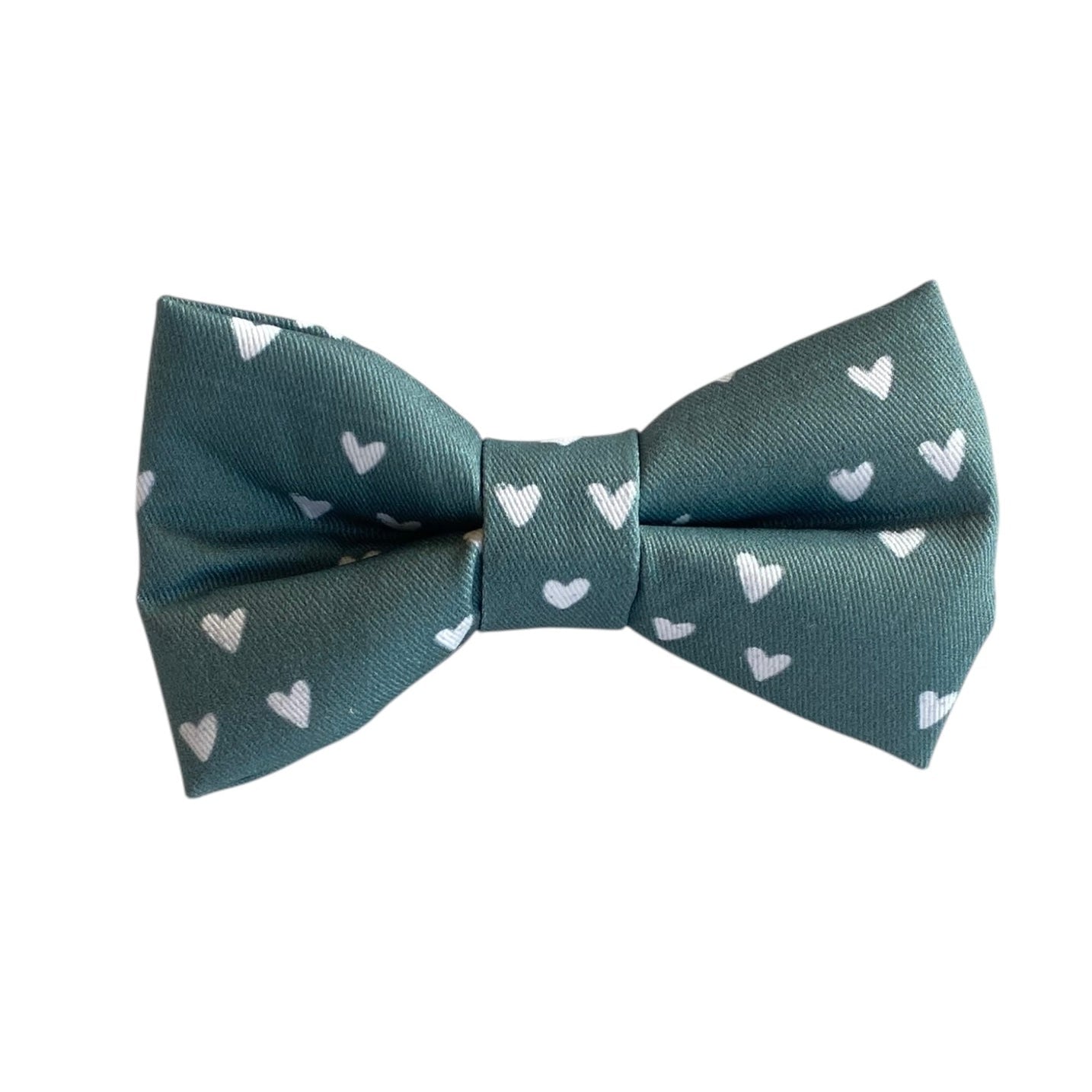 This adorable dog bow tie features a soft sage green background with delicate white heart accents, making it a perfect choice for Valentine’s Day or any occasion celebrating love. With an adjustable Velcro strap, it securely attaches to any collar, providing a snug and comfortable fit for dogs of all sizes. Add a touch of charm and sweetness to your pup’s look with this lovely accessory!