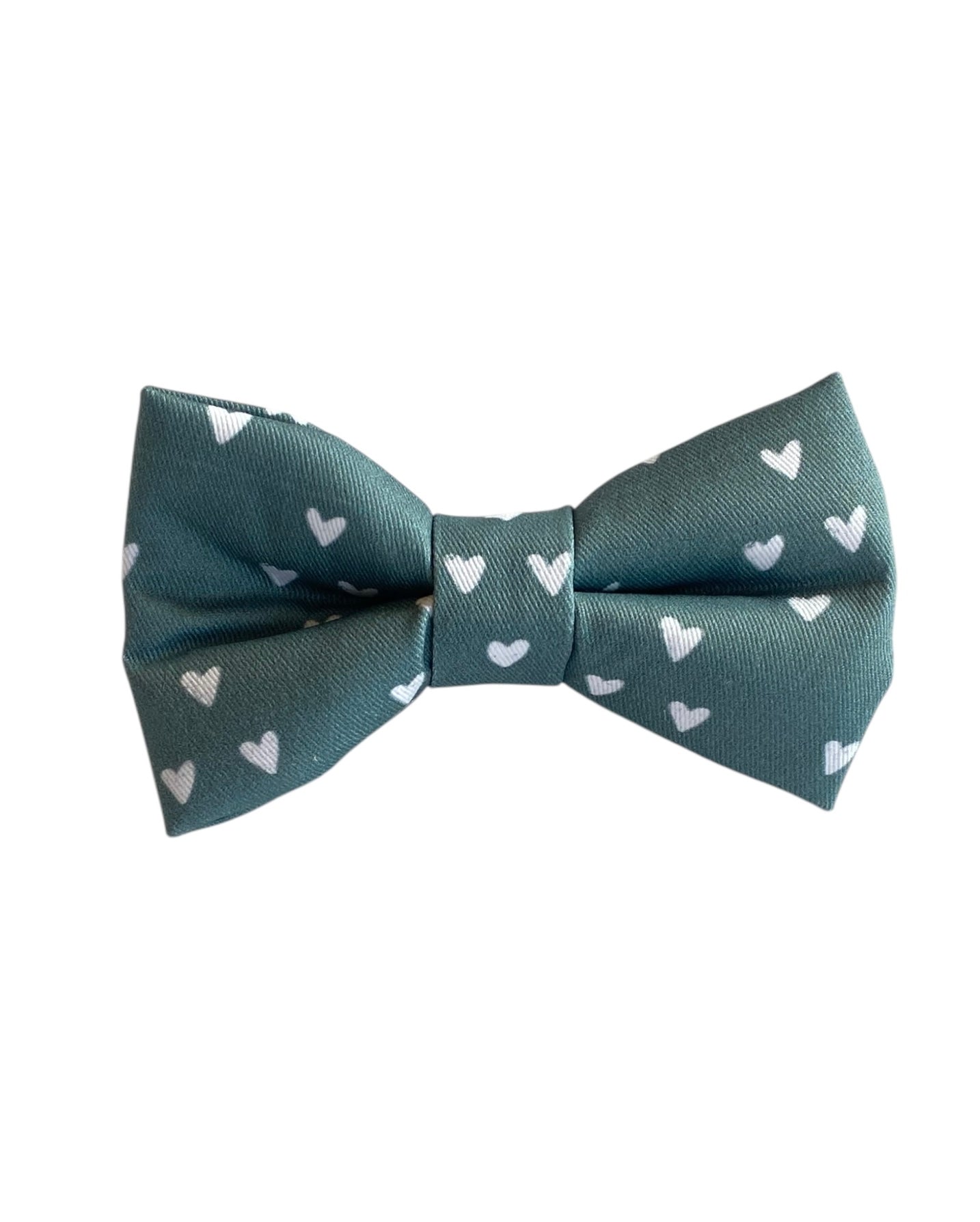 This adorable dog bow tie features a soft sage green background with delicate white heart accents, making it a perfect choice for Valentine’s Day or any occasion celebrating love. With an adjustable Velcro strap, it securely attaches to any collar, providing a snug and comfortable fit for dogs of all sizes. Add a touch of charm and sweetness to your pup’s look with this lovely accessory!