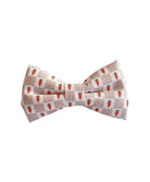 This adorable dog bow tie features a beige and white checkered pattern adorned with tiny carrots, making it the perfect accessory for Easter or springtime festivities. Designed with an adjustable Velcro strap, it attaches securely to any collar, ensuring a snug and comfortable fit for dogs of all sizes. Add a touch of seasonal charm to your pup's wardrobe with this delightful bow tie!