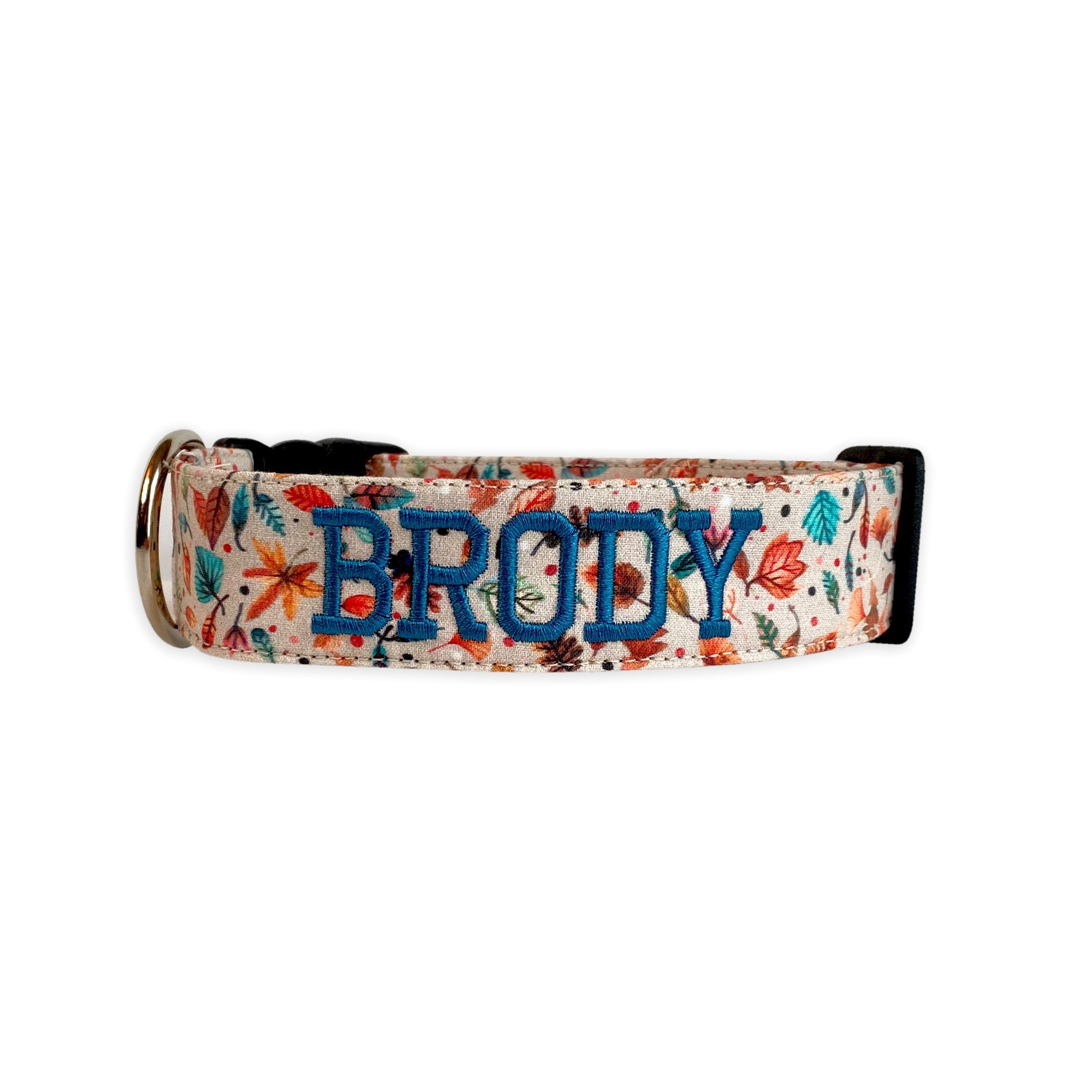 Personalized Dog Collar, Custom Dog Collar, Embroidered Dog Collar by Duke & Fox. Cream Dog Collar with multi colored fall leaves and a dark turquoise name embroidered.