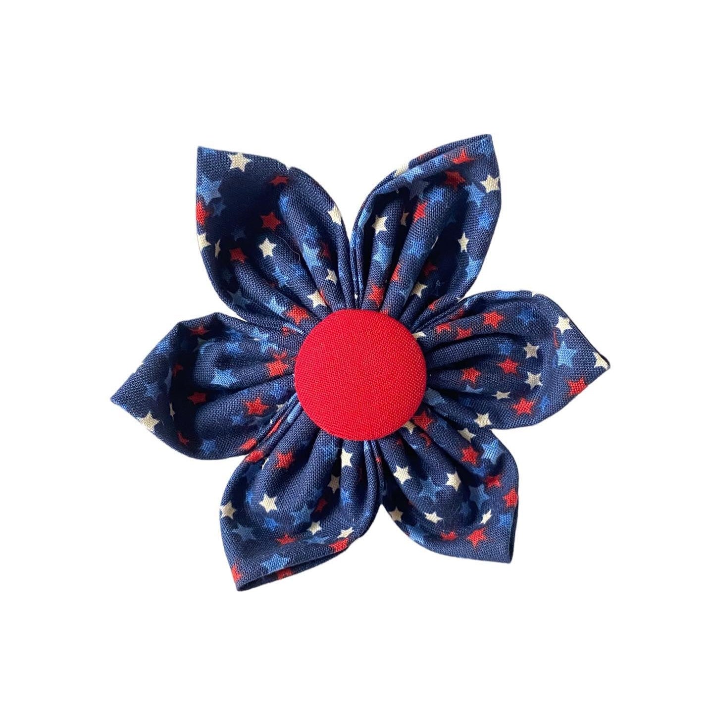A very patriotic dog collar flower shaped accessory. Navy blue with red white and blue stars printed all over.