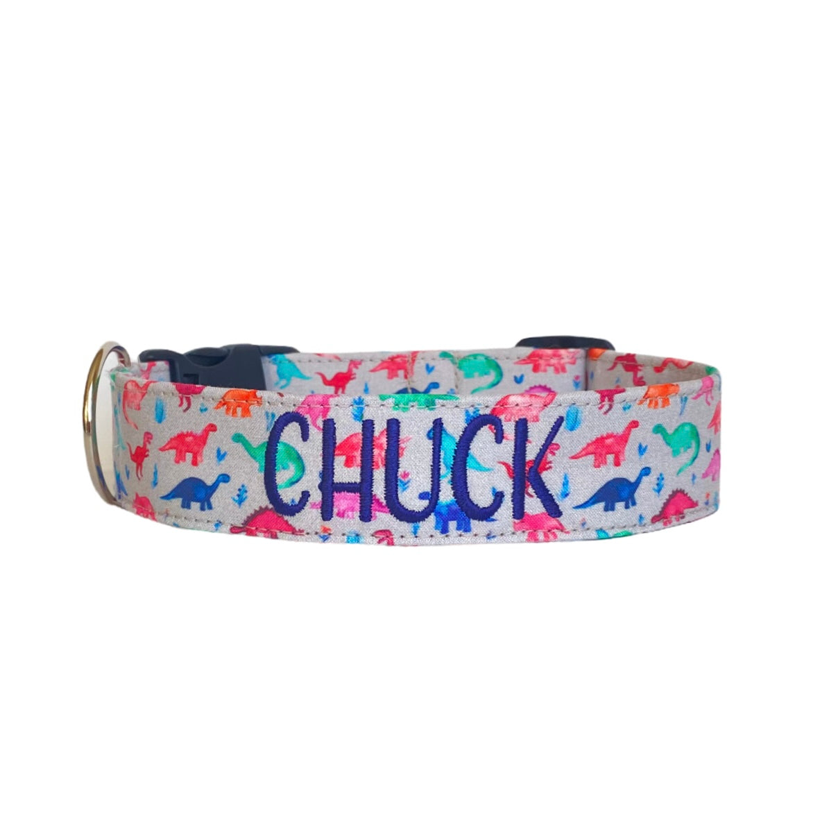 Whether choosing from a traditional dog collar, embroidered dog collar, or engraved buckle dog collar, you’ll find a great selection of personalized dog collars to choose from. Duke & Fox® personalized dog collars come in a variety of unique styles and patterns. Our embroidered collars and engraved buckle collars also add to your dog's safety and your peace of mind with critical contact information should you and your dog get separated. Gray dinosaur dog collar.