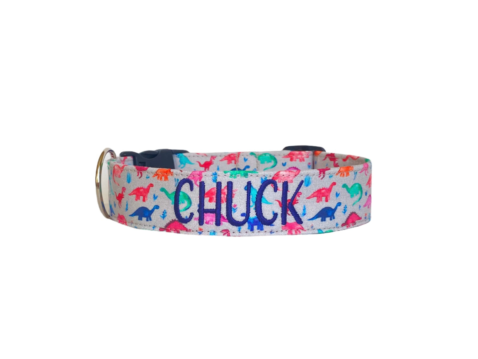 Whether choosing from a traditional dog collar, embroidered dog collar, or engraved buckle dog collar, you’ll find a great selection of personalized dog collars to choose from. Duke & Fox® personalized dog collars come in a variety of unique styles and patterns. Our embroidered collars and engraved buckle collars also add to your dog's safety and your peace of mind with critical contact information should you and your dog get separated. Gray dinosaur dog collar.