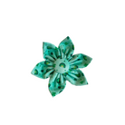 Green dog collar flower featuring small green rainbows and green shamrocks.