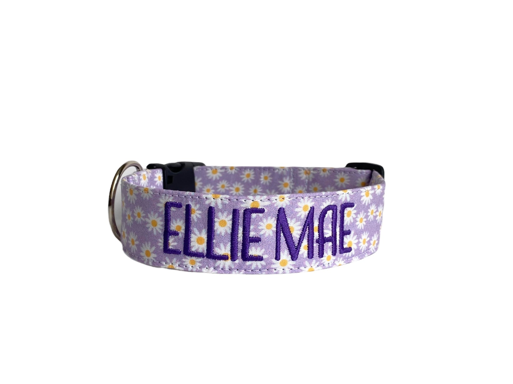 Whether choosing from a traditional dog collar, embroidered dog collar, or engraved buckle dog collar, you’ll find a great selection of personalized dog collars to choose from.  Duke & Fox® personalized dog collars come in a variety of unique styles and patterns. Our embroidered collars and engraved buckle collars also add to your dog's safety and your peace of mind with critical contact information should you and your dog get separated.  Lavender dog collar with white daisies.