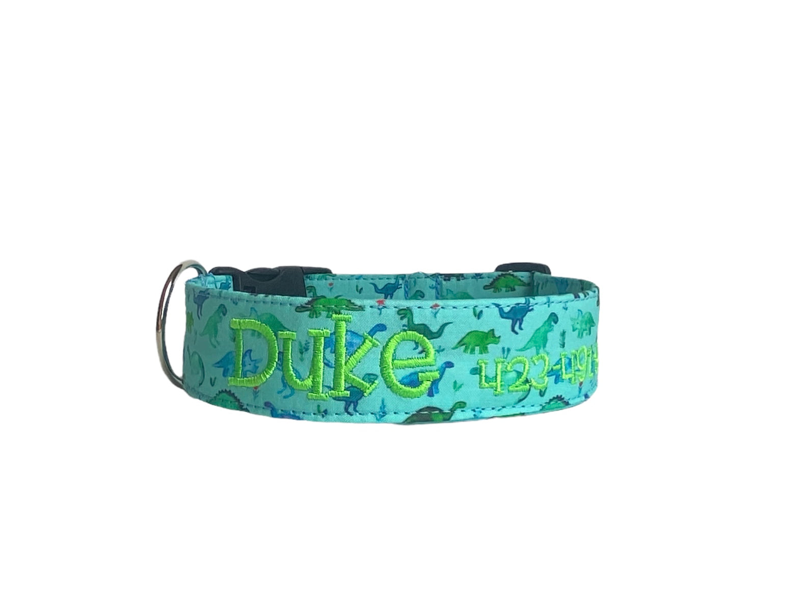 Whether choosing from a traditional dog collar, embroidered dog collar, or engraved buckle dog collar, you’ll find a great selection of personalized dog collars to choose from. Duke & Fox® personalized dog collars come in a variety of unique styles and patterns. Our embroidered collars and engraved buckle collars also add to your dog's safety and your peace of mind with critical contact information should you and your dog get separated. Blue dinosaur dog collar.