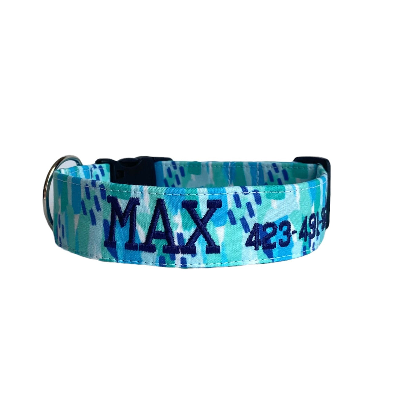 Whether choosing from a traditional dog collar, embroidered dog collar, or engraved buckle dog collar, you’ll find a great selection of personalized dog collars to choose from.  Duke & Fox® personalized dog collars come in a variety of unique styles and patterns. Our embroidered collars and engraved buckle collars also add to your dog's safety and your peace of mind with critical contact information should you and your dog get separated.  Blue abstract dog collar.