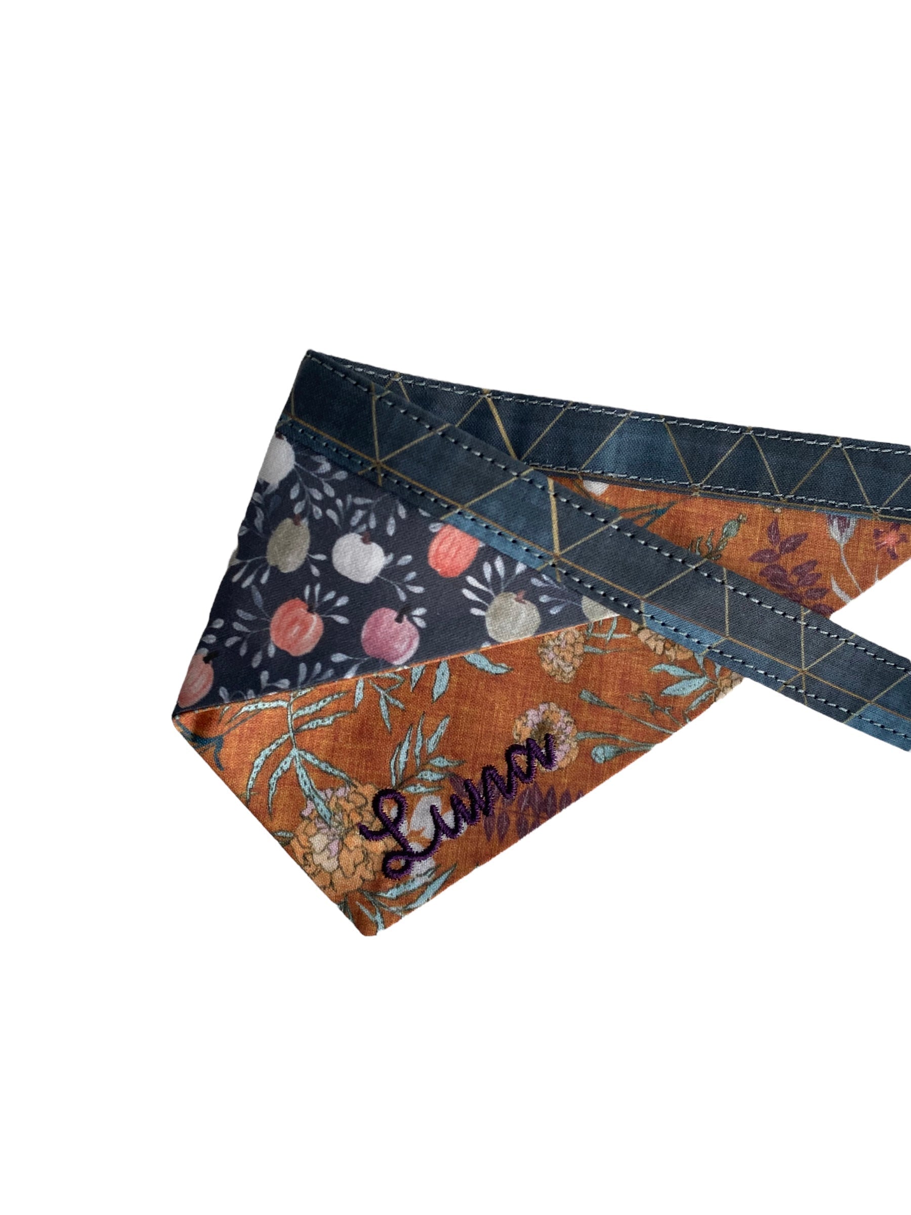 A personalized bandana by Duke & Fox is the perfect pet accessory that is customized with the pet's name. Bandanas that are double sided for more options. Rustic floral embroidered dog bandana. Farmhouse pumpkins dog bandana.