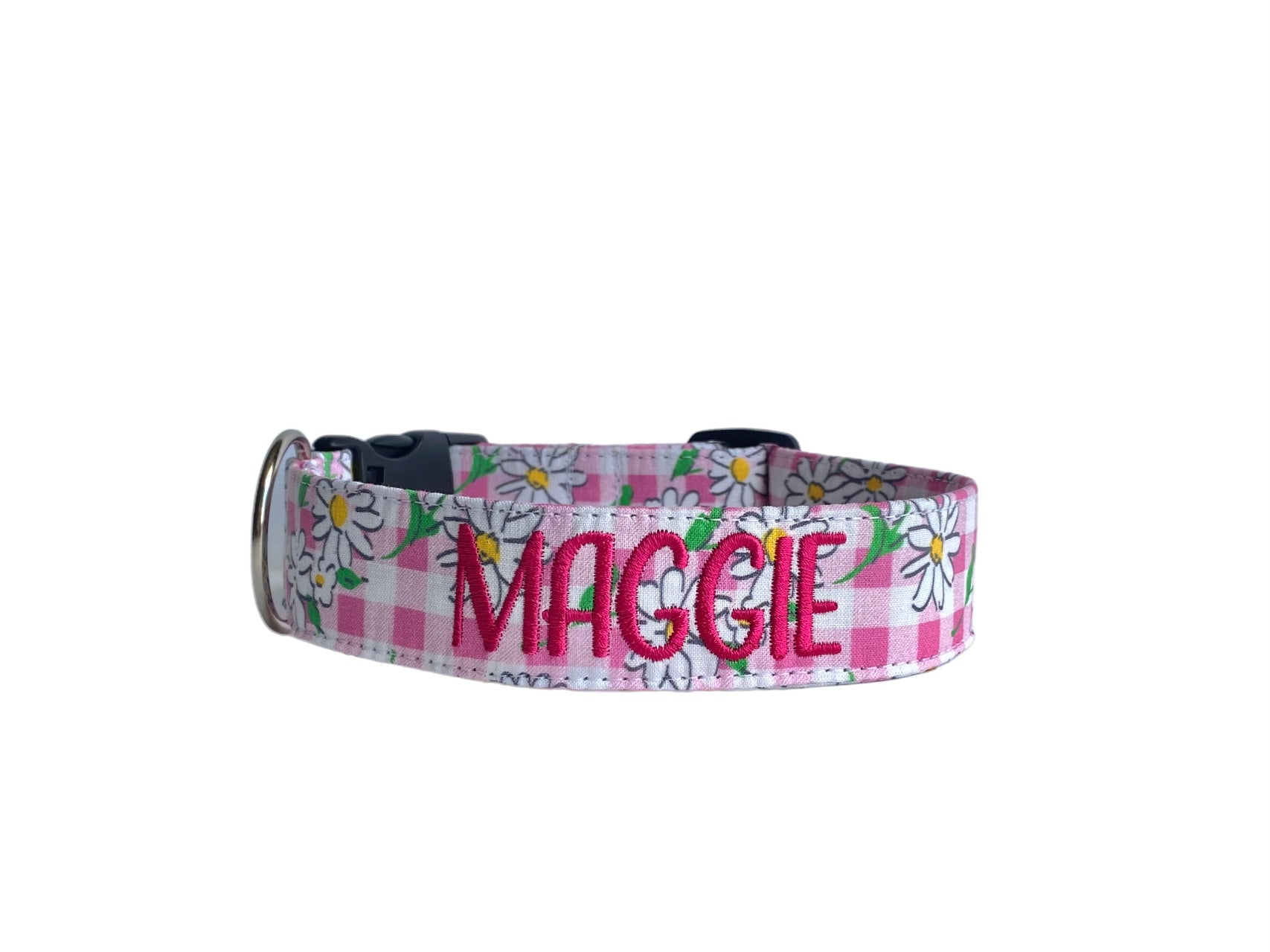 Whether choosing from a traditional dog collar, embroidered dog collar, or engraved buckle dog collar, you’ll find a great selection of personalized dog collars to choose from.  Duke & Fox® personalized dog collars come in a variety of unique styles and patterns. Our embroidered collars and engraved buckle collars also add to your dog's safety and your peace of mind with critical contact information should you and your dog get separated.  Pink ging daisy dog collar.