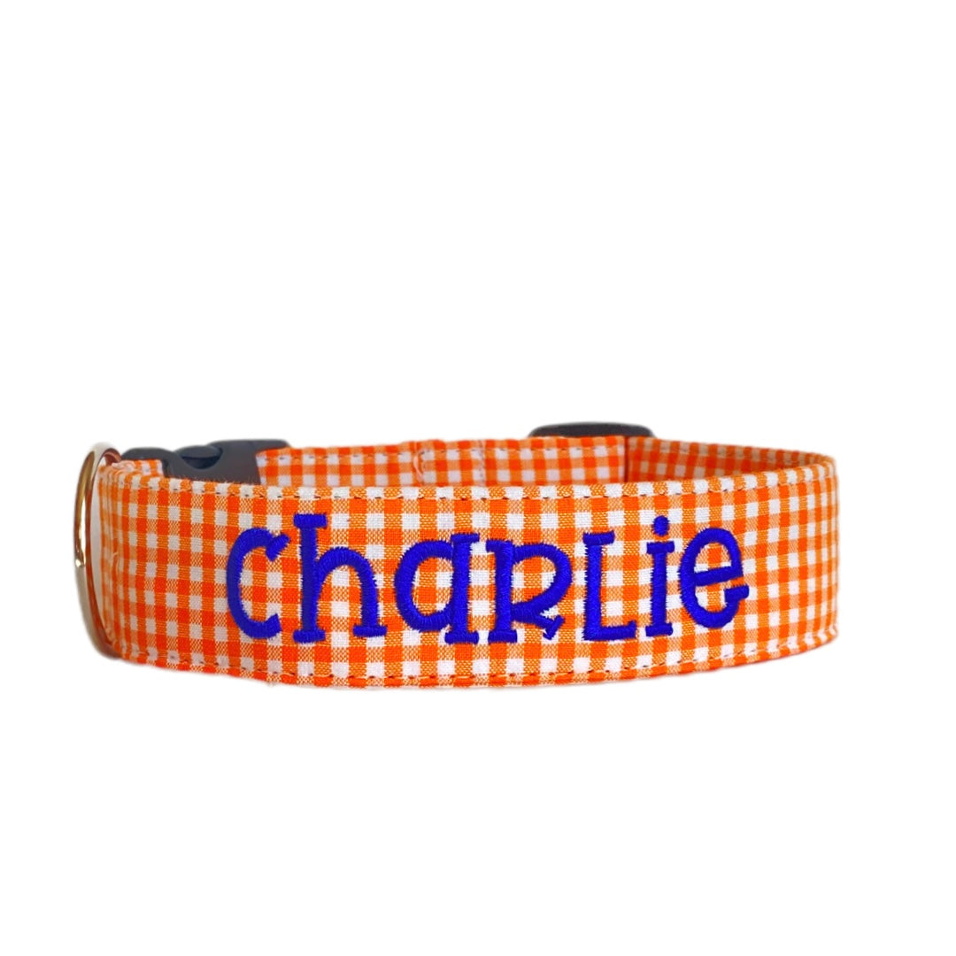 Whether choosing from a traditional dog collar, embroidered dog collar, or engraved buckle dog collar, you’ll find a great selection of personalized dog collars to choose from. Duke & Fox® personalized dog collars come in a variety of unique styles and patterns. Our embroidered collars and engraved buckle collars also add to your dog's safety and your peace of mind with critical contact information should you and your dog get separated. Orange gingham dog collar.