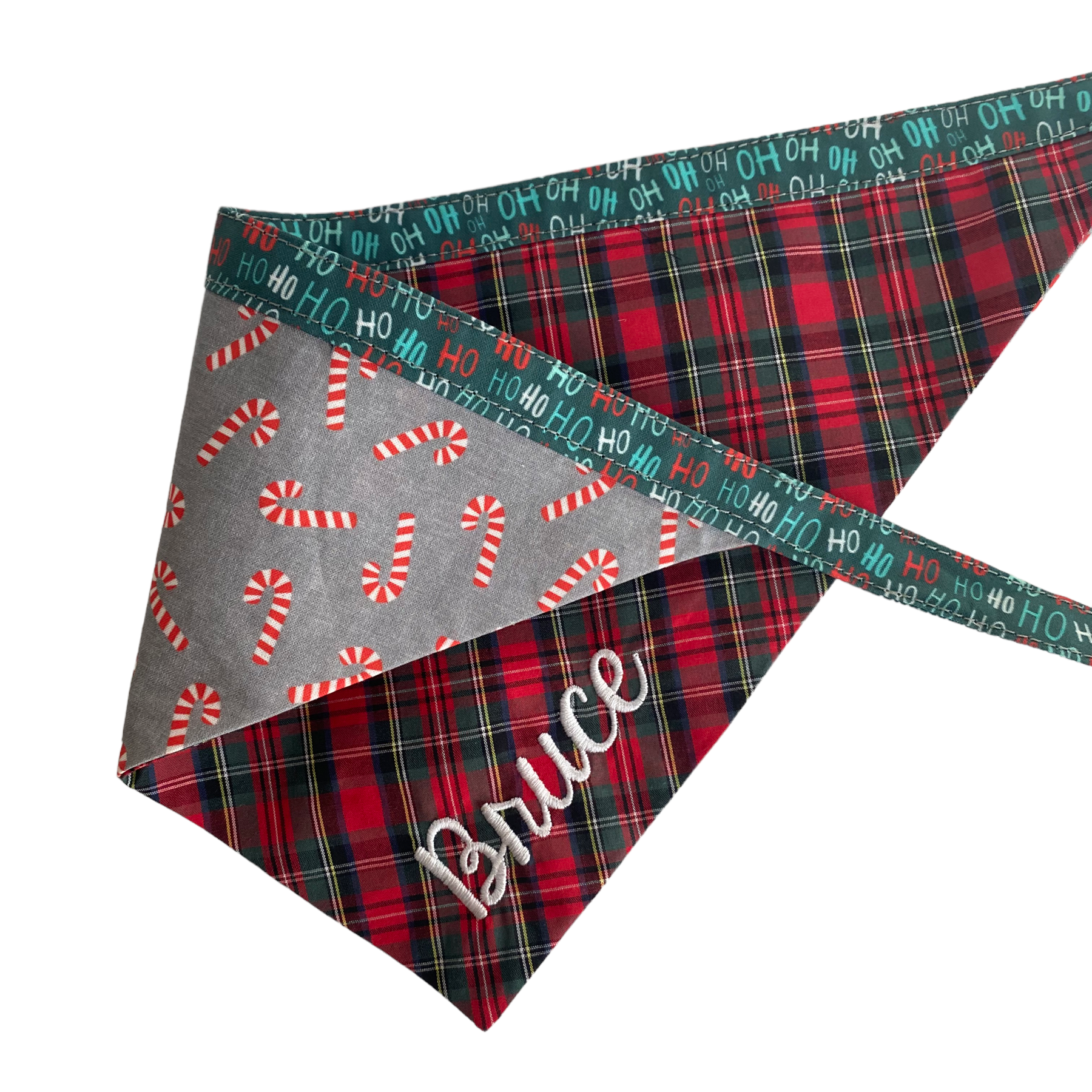A personalized bandana by Duke & Fox is the perfect pet accessory that is customized with the pet's name. Bandanas that are double sided for more options. Buffalo plaid embroidered dog bandana. Christmas candy cane embroidered dog bandana.