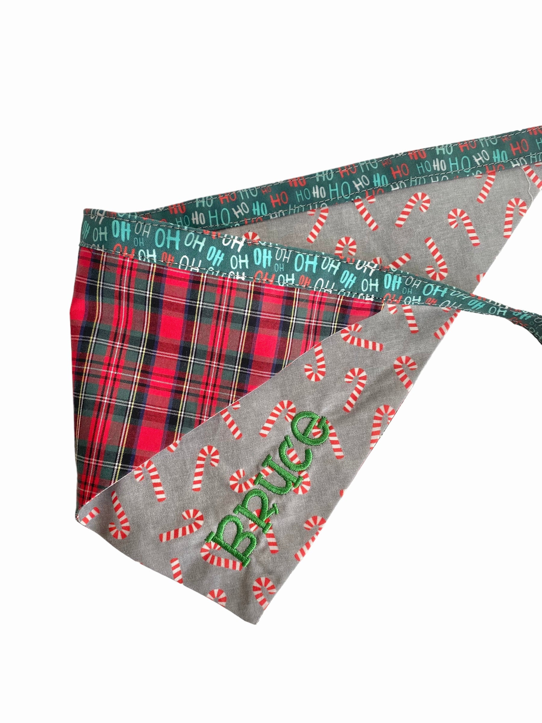 A personalized bandana by Duke & Fox is the perfect pet accessory that is customized with the pet's name. Bandanas that are double sided for more options. Christmas candy cane embroidered dog bandana. Buffalo plaid embroidered dog bandana.