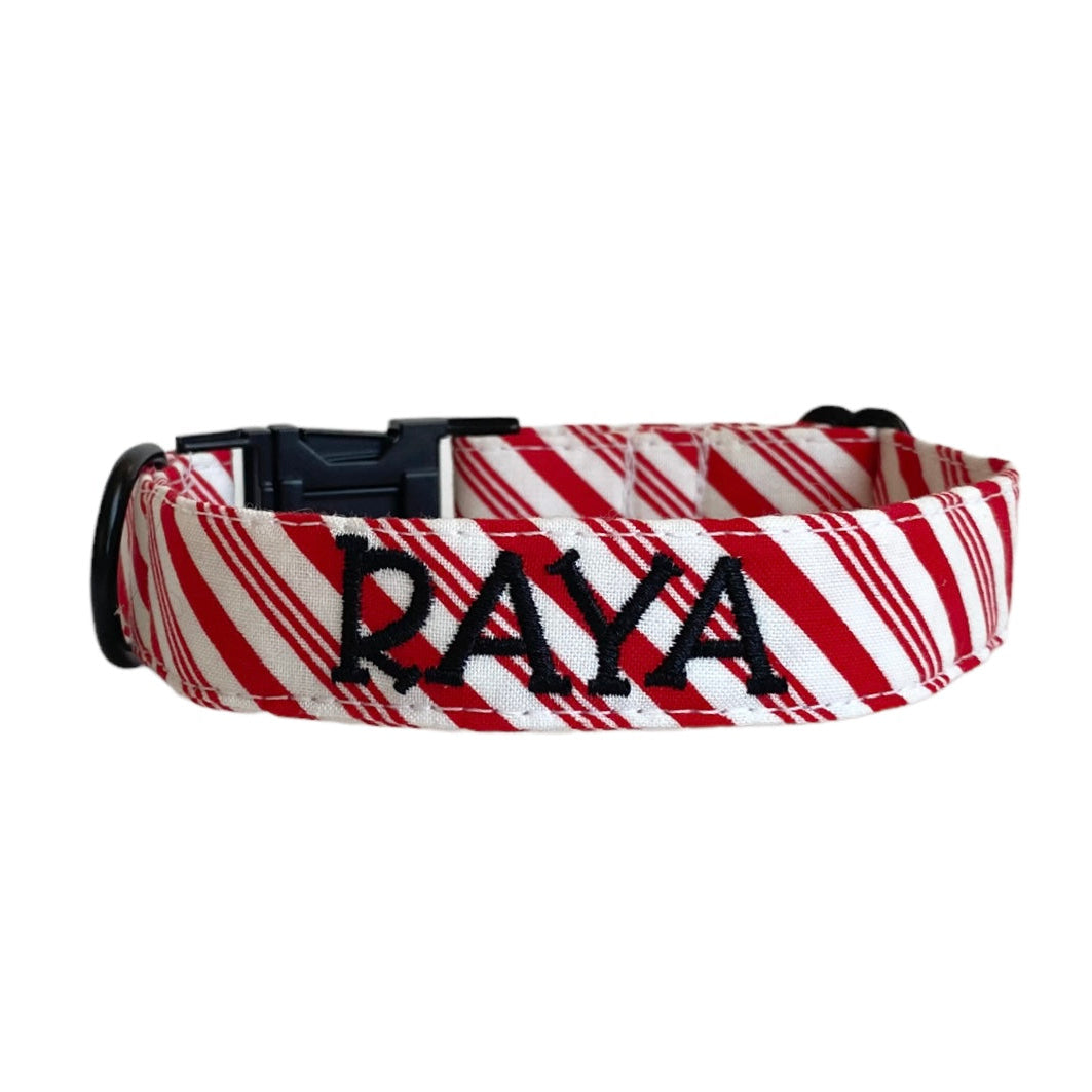Whether choosing from a traditional dog collar, embroidered dog collar, or engraved buckle dog collar, you’ll find a great selection of personalized dog collars to choose from. Duke & Fox® personalized dog collars come in a variety of unique styles and patterns. Our embroidered collars and engraved buckle collars also add to your dog's safety and your peace of mind with critical contact information should you and your dog get separated. Christmas candy cane dog collar.