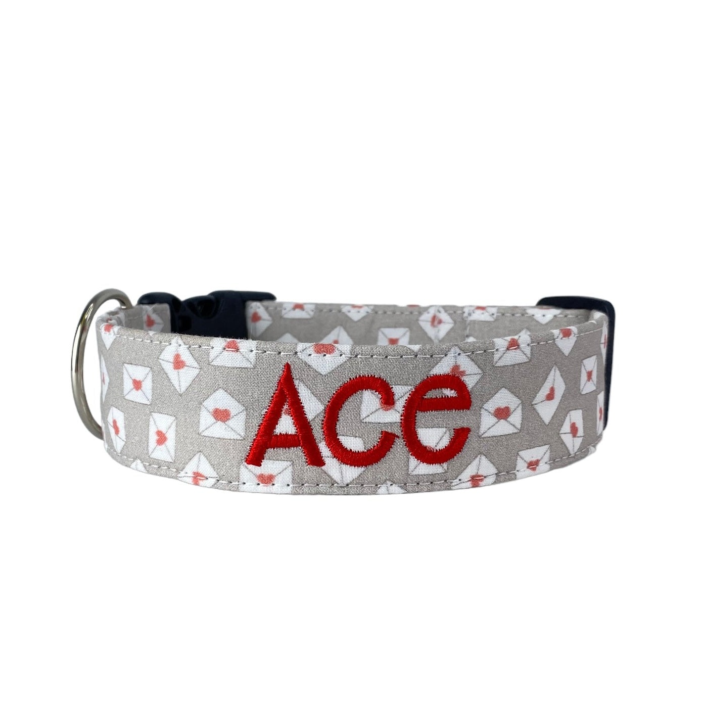 Duke & Fox Personalized Valetines Dog Collar with an embroidered name on a beige pattern with mini love letters.