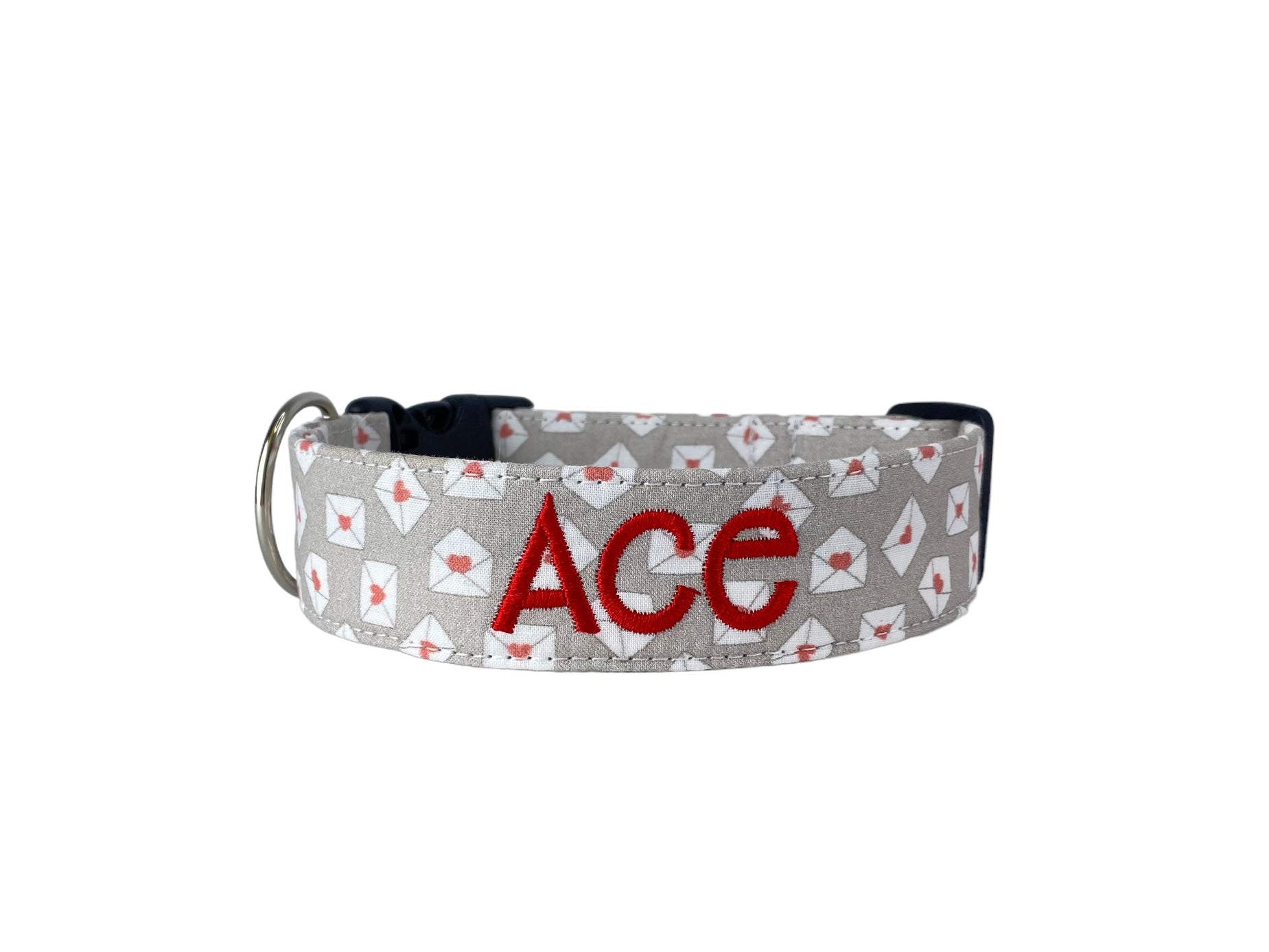Duke & Fox Personalized Valetines Dog Collar with an embroidered name on a beige pattern with mini love letters.
