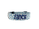 Whether choosing from a traditional dog collar, embroidered dog collar, or engraved buckle dog collar, you’ll find a great selection of personalized dog collars to choose from.  Duke & Fox® personalized dog collars come in a variety of unique styles and patterns. Our embroidered collars and engraved buckle collars also add to your dog's safety and your peace of mind with critical contact information should you and your dog get separated.  Blue daisy dog collar.