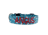 Cow pattern dog collar, dog collar with cows, personalized cow dog collar with embroidered name. Blue dog collar with holstein cow pattern and an embroidered name with red thread. Custom dog collar by Duke and Fox. 