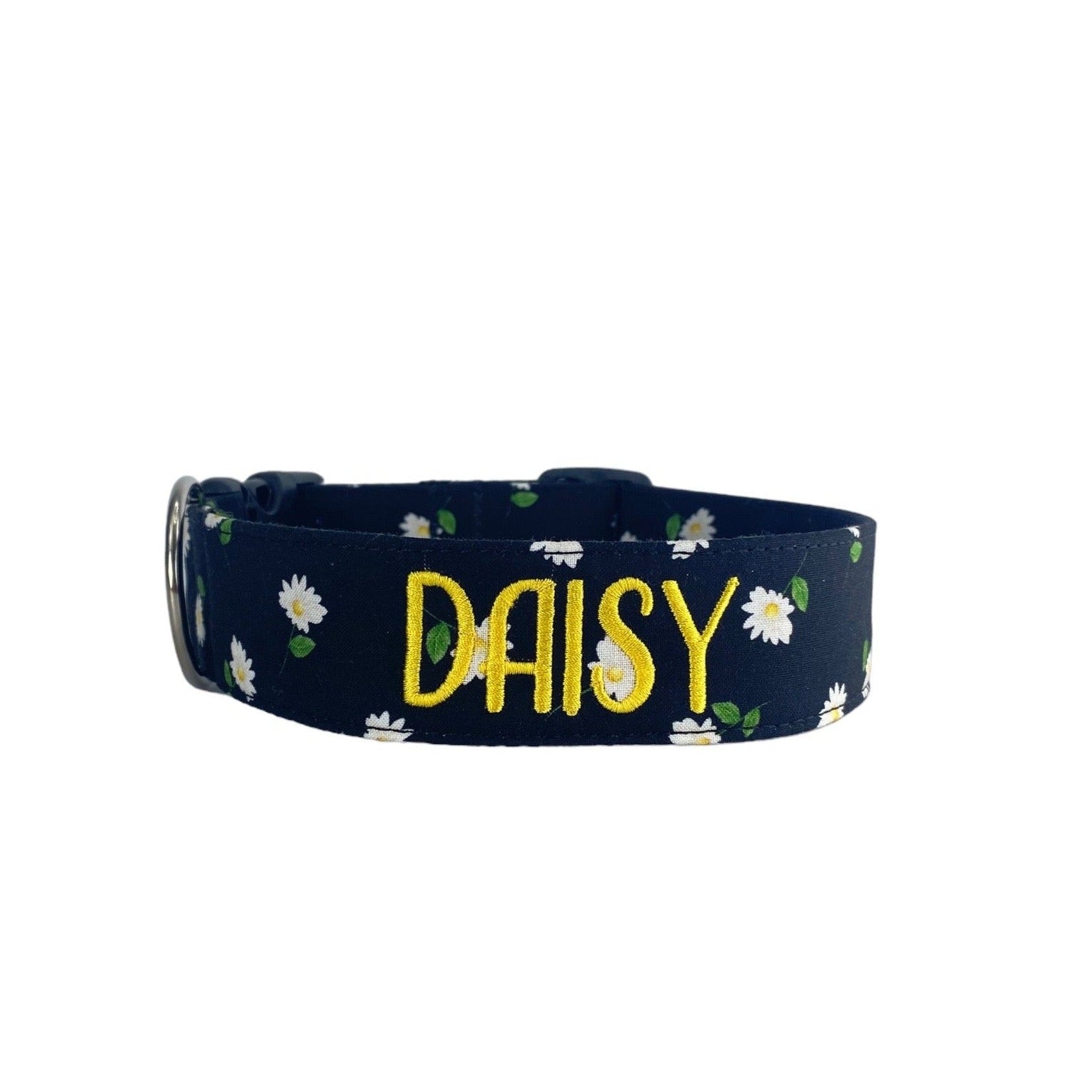 Whether choosing from a traditional dog collar, embroidered dog collar, or engraved buckle dog collar, you’ll find a great selection of personalized dog collars to choose from.  Duke & Fox® personalized dog collars come in a variety of unique styles and patterns. Our embroidered collars and engraved buckle collars also add to your dog's safety and your peace of mind with critical contact information should you and your dog get separated.  Black dog collar with white daisies.