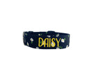 Whether choosing from a traditional dog collar, embroidered dog collar, or engraved buckle dog collar, you’ll find a great selection of personalized dog collars to choose from.  Duke & Fox® personalized dog collars come in a variety of unique styles and patterns. Our embroidered collars and engraved buckle collars also add to your dog's safety and your peace of mind with critical contact information should you and your dog get separated.  Black dog collar with white daisies.