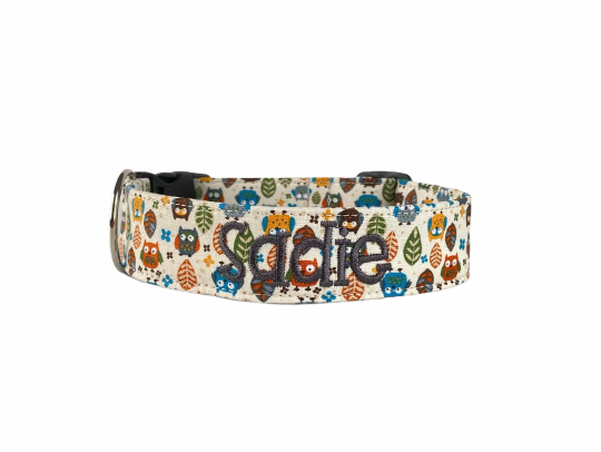 Owl Dog Collar. Custom Dog Collar by Duke and Fox. Personalized Dog Collar with owls. Embroidered Dog Collar. Owl Pattern Collar with green, orange, and blue owls, and leaves with an embroidered dark gray name.