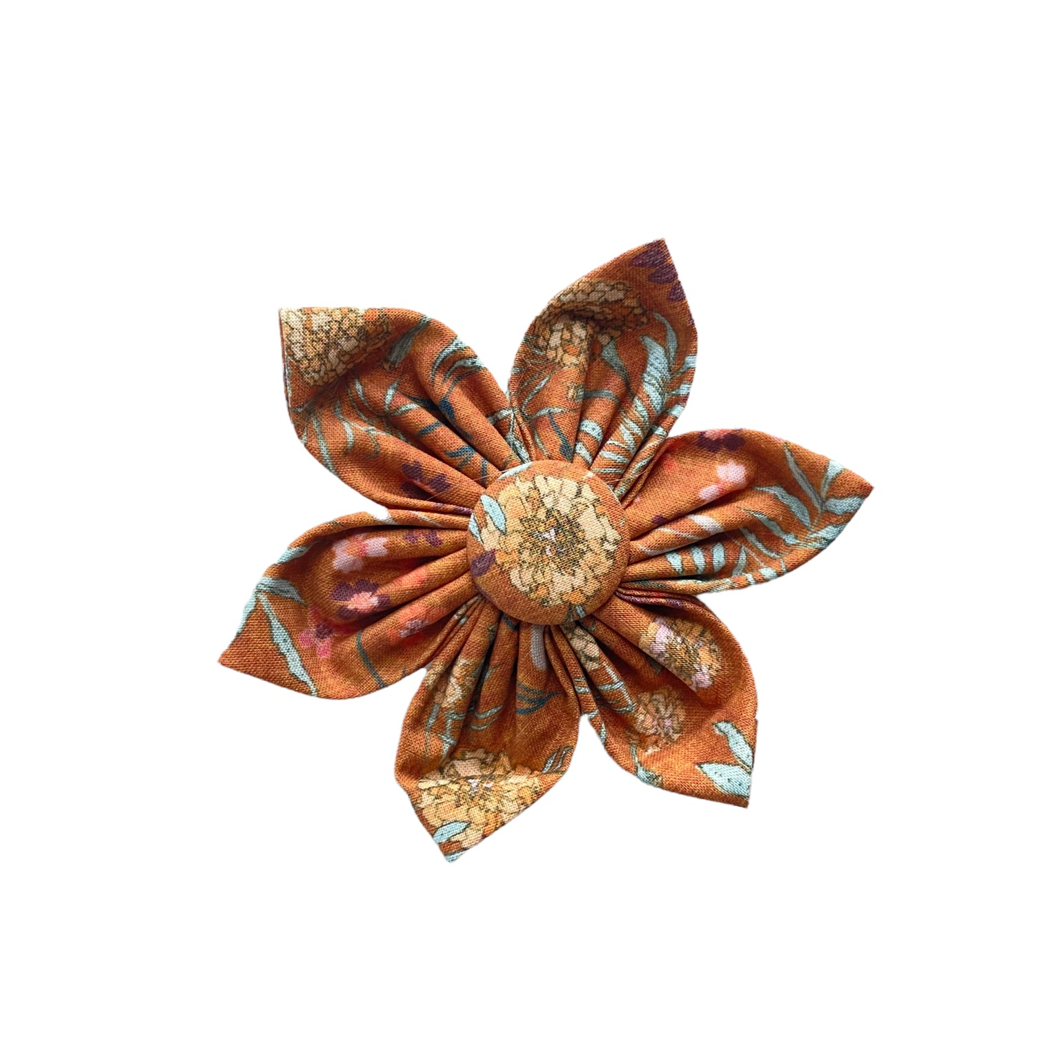 Rustic floral dog collar flower accessory with burnt orange background and yellow, pale blue floral designs.
