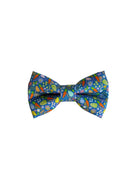 Colorful bow tie with a carrot, Easter egg, flower, and bow pattern on a white background.  Adjustable with velcro.  Custom dog bow tie by Duke & Fox.
