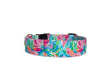 This vibrant, colorful dog collar is perfect for summer and beach adventures! Featuring a lively floral-inspired design in bright pinks, blues, greens, and oranges, it radiates tropical vibes. The collar can be personalized with embroidery, such as your dog’s name, and features an optional engraved buckle for added safety and charm. Stylish, practical, and unique, it’s a must-have for sunny getaways with your pup!