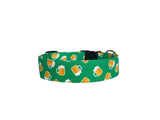 Celebrate St. Patrick's Day in style with this festive dog collar featuring a playful beer mug pattern on a vibrant green background. Perfect for the holiday, this collar can be personalized with your pet’s name, either embroidered in bold lettering or with an engraved buckle for a sleek and durable touch. Made with premium materials and sturdy hardware, it’s both fun and functional—ideal for showing off your pup’s holiday spirit while keeping them secure!