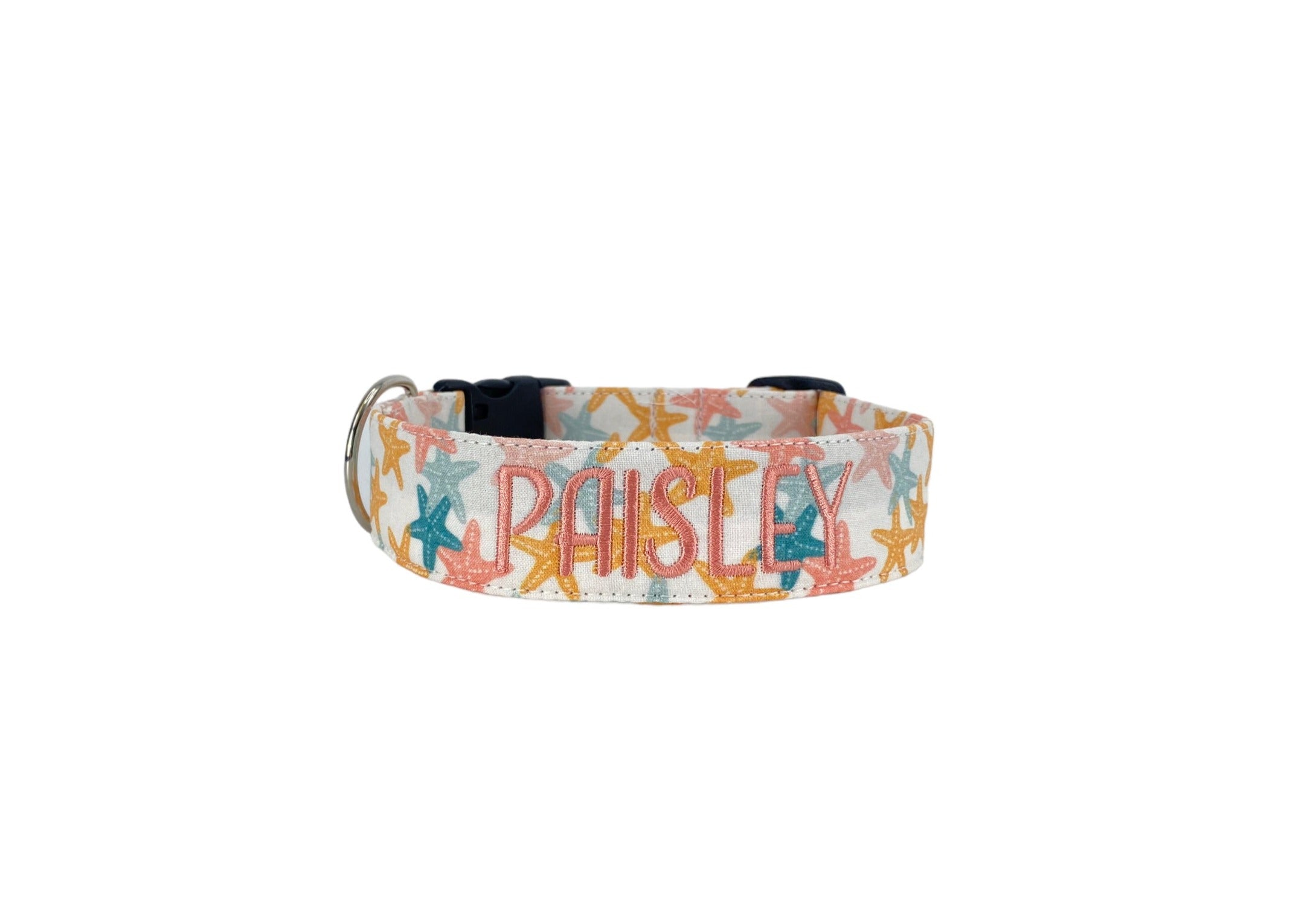 Whether choosing from a traditional dog collar, embroidered dog collar, or engraved buckle dog collar, you’ll find a great selection of personalized dog collars to choose from.  Duke & Fox® personalized dog collars come in a variety of unique styles and patterns. Our embroidered collars and engraved buckle collars also add to your dog's safety and your peace of mind with critical contact information should you and your dog get separated.  Coral starfish dog collar. 