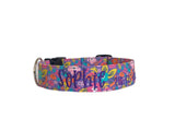Whether choosing from a traditional dog collar, embroidered dog collar, or engraved buckle dog collar, you’ll find a great selection of personalized dog collars to choose from.  Duke & Fox® personalized dog collars come in a variety of unique styles and patterns. Our embroidered collars and engraved buckle collars also add to your dog's safety and your peace of mind with critical contact information should you and your dog get separated.  Pink and purple floral dog collar. 
