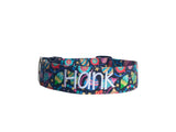 Whether choosing from a traditional dog collar, embroidered dog collar, or engraved buckle dog collar, you’ll find a great selection of personalized dog collars to choose from.  Duke & Fox® personalized dog collars come in a variety of unique styles and patterns. Our embroidered collars and engraved buckle collars also add to your dog's safety and your peace of mind with critical contact information should you and your dog get separated.  Christmas ornaments dog collar. 