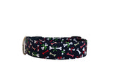 Whether choosing from a traditional dog collar, embroidered dog collar, or engraved buckle dog collar, you’ll find a great selection of personalized dog collars to choose from.  Duke & Fox® personalized dog collars come in a variety of unique styles and patterns. Our embroidered collars and engraved buckle collars also add to your dog's safety and your peace of mind with critical contact information should you and your dog get separated.  Christmas bones dog collar. 