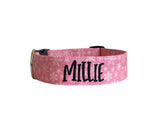 Whether choosing from a traditional dog collar, embroidered dog collar, or engraved buckle dog collar, you’ll find a great selection of personalized dog collars to choose from.  Duke & Fox® personalized dog collars come in a variety of unique styles and patterns. Our embroidered collars and engraved buckle collars also add to your dog's safety and your peace of mind with critical contact information should you and your dog get separated.  Christmas pink snowflake dog collar. 