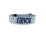 Whether choosing from a traditional dog collar, embroidered dog collar, or engraved buckle dog collar, you’ll find a great selection of personalized dog collars to choose from.  Duke & Fox® personalized dog collars come in a variety of unique styles and patterns. Our embroidered collars and engraved buckle collars also add to your dog's safety and your peace of mind with critical contact information should you and your dog get separated.  Blue daisy dog collar. 