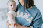 Mama Sweatshirt worn by model holding baby. 